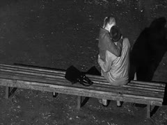 On the bench, my friend caught a charming dilettante pair touching each other.